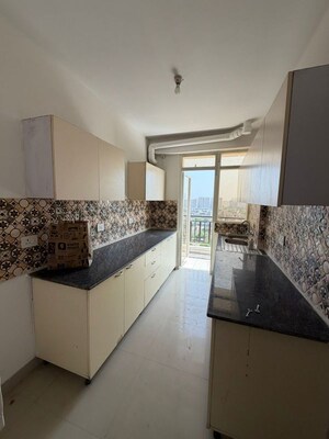 Kitchen in 4 BHK Apartment at Amrapali Leisure Park, Amrapali Leisure Valley – for Sale