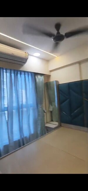Bedroom in 2 BHK Apartment at Infinity Paradise CHS, Goregaon West – for Rent