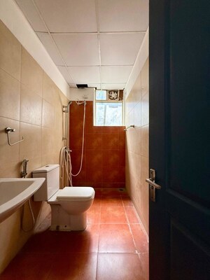 Bathroom in 3 BHK Apartment at Sushma Elite Cross, Dhakoli – for Rent
