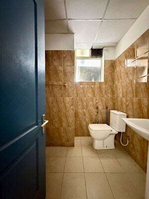 Bathroom in 3 BHK Apartment at Sushma Elite Cross, Dhakoli – for Rent