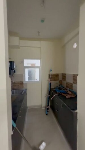 Kitchen in 2 BHK Apartment at Amrapali Enchante, Tech Zone 4 Greater Noida – for Sale