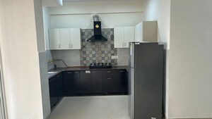 Kitchen in 3.5 BHK Apartment at Aims Golf City, Sector 75 – for Rent