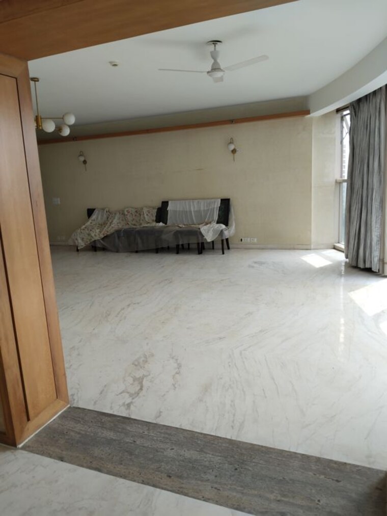 Living Room, jaypee-green-sun-court-tower-iii 3 Bedroom 3850 Sq.Ft. Apartment In Jaypee Greens Greater Noida 10370752