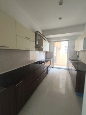Kitchen in 4 BHK Apartment at Mahagun Marvella, Sector 78 – for Rent