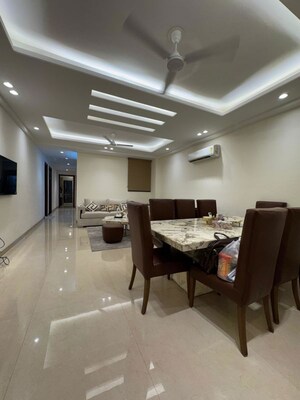 Living Room in 4 BHK Apartment at Chattarpur – for Sale