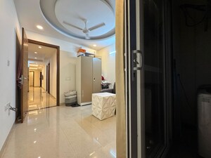 Living Room in 4 BHK Apartment at Chattarpur – for Sale