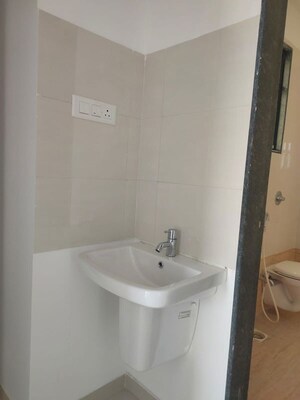 Bathroom in 2 BHK Apartment at Royal Ishana, Thergaon – for Rent