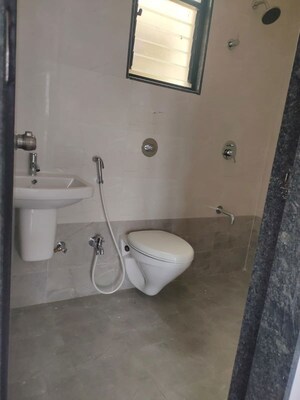 Bathroom in 2 BHK Apartment at Royal Ishana, Thergaon – for Rent