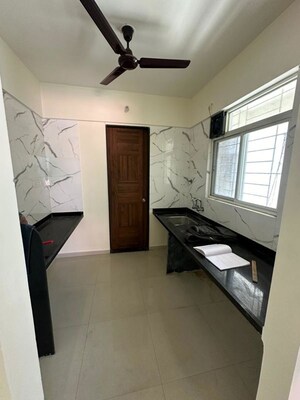 Kitchen in 2 BHK Apartment at Divine Reves, Wakad – for Sale