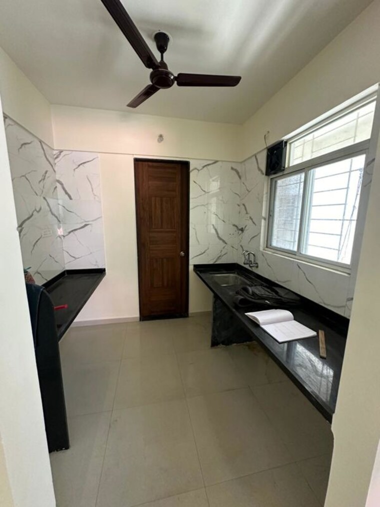 Kitchen, divine-reves 2 Bedroom 860 Sq.Ft. Apartment In Wakad Pune 10370983