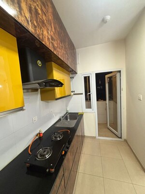 Kitchen in 2 BHK Apartment at Bhartiya Nikoo Homes, Thanisandra Main Road – for Rent
