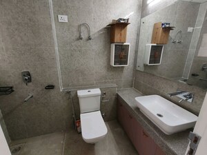 Bathroom in 2 BHK Apartment at Eldeco Live By The Greens, Sector 150 – for Rent