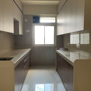 Kitchen in 2 BHK Apartment at Rustomjee Summit, Datta Pada – for Rent