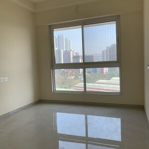 Room in 2 BHK Apartment at Rustomjee Summit, Datta Pada – for Rent