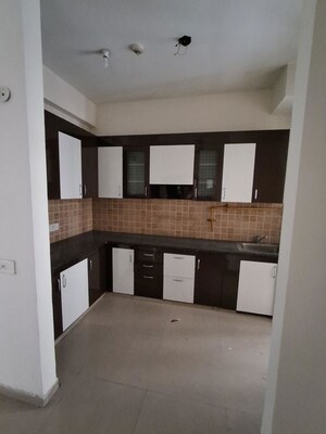 Kitchen in 3 BHK Apartment at Mahagun Mywoods III, Sector 16c Greater Noida – for Rent