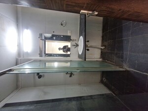Bathroom in 4 BHK Apartment at Mahagun Moderne Low Rise, Sector 78 – for Rent