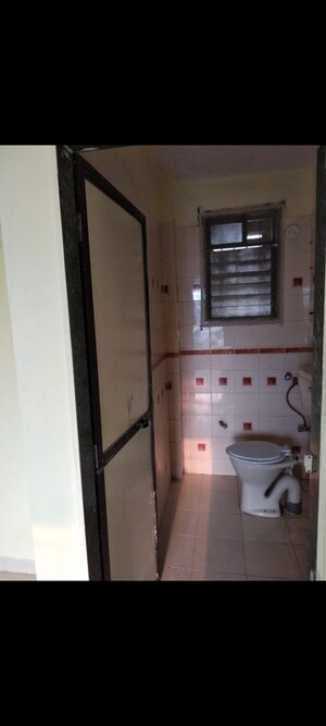 Kitchen in 2 BHK Apartment at Soniya CHS, Sector 4a Kopar Khairane – for Rent