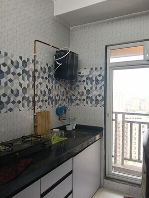 Kitchen in 1 BHK Apartment at Raunak Bliss, Ghodbunder Road – for Rent