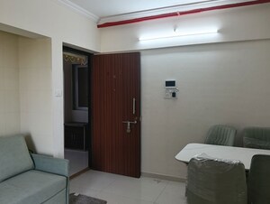 Living Room in 1 BHK Apartment at Raunak Bliss, Ghodbunder Road – for Rent