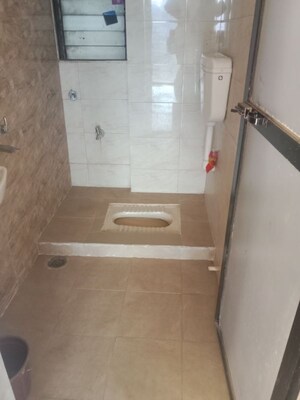 Bathroom in 2 BHK Apartment at Navkar City Phase II, Naigaon East – for Rent