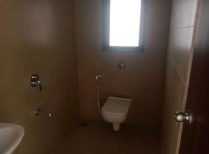 Bathroom in 1.5 BHK Apartment at Dosti West County, Balkum Pada – for Rent
