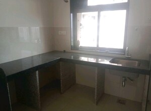 Kitchen in 1.5 BHK Apartment at Dosti West County, Balkum Pada – for Rent