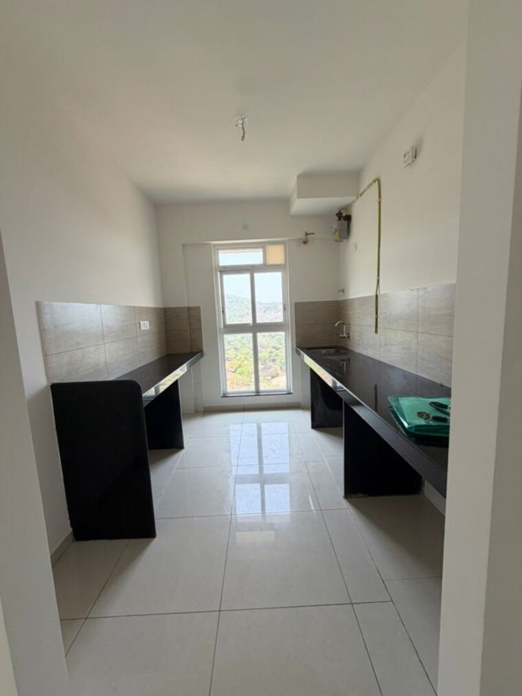 Kitchen, godrej-emerald 2 Bedroom 637 Sq.Ft. Apartment In Ghodbunder Road Thane 10372827