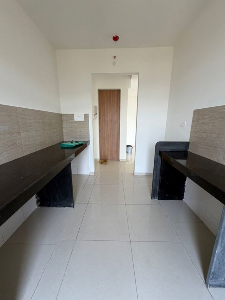 Kitchen, godrej-emerald 2 Bedroom 637 Sq.Ft. Apartment In Ghodbunder Road Thane 10372827