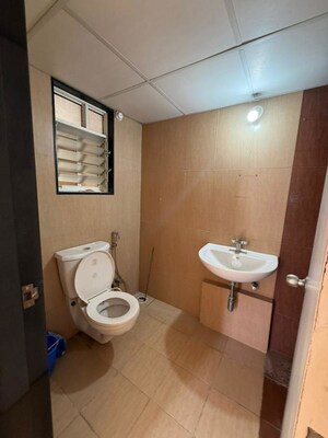 Bathroom in 3 BHK Apartment at Paranjape Schemes Saptagiri, Baner – for Rent