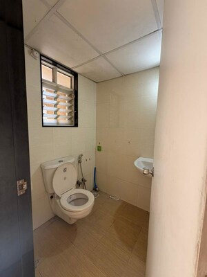 Bathroom in 3 BHK Apartment at Paranjape Schemes Saptagiri, Baner – for Rent