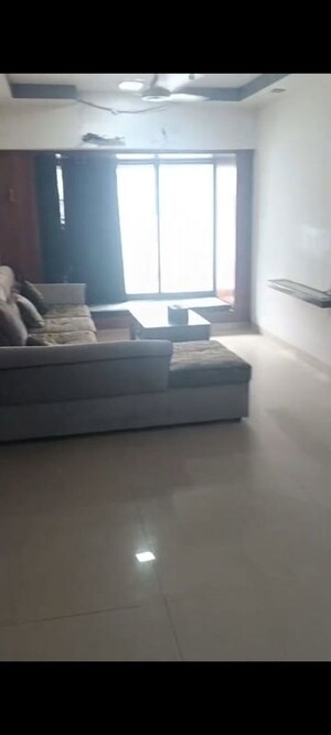 Living Room in 2 BHK Apartment at K Raheja Palm Court, Malad West – for Rent