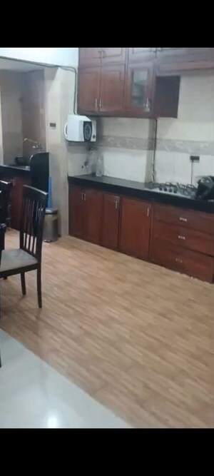 Kitchen in 2 BHK Apartment at K Raheja Palm Court, Malad West – for Rent