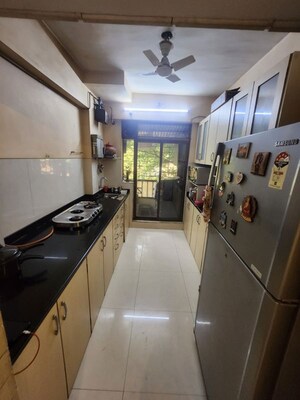 Kitchen in 2 BHK Apartment at Cosmos Jewels, Ghodbunder Road – for Rent
