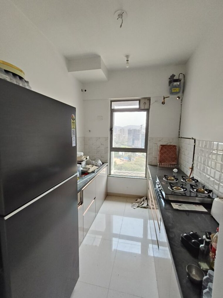 Kitchen, kalpataru-immensa 2 Bedroom 598 Sq.Ft. Apartment In Kolshet Road Thane 10373896