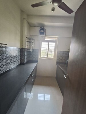 Kitchen in 1 BHK Apartment at Lodha Amara, Kolshet Road – for Sale
