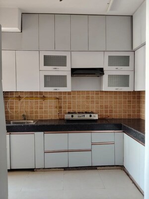 Kitchen in 2 BHK Apartment at Mahagun My Woods, Sector 16c Greater Noida – for Rent