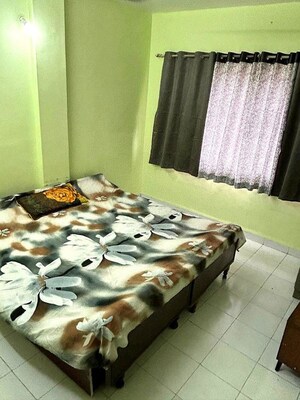 Bedroom in 3 BHK Apartment at Riddhi Enclave Co-op Housing Society Ltd, Viman Nagar – for Rent