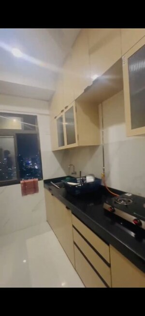Kitchen in 2 BHK Apartment at Dev Leo Tower, Oshiwara – for Rent