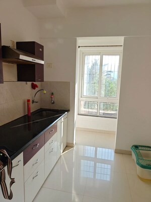 Kitchen in 1 BHK Apartment at Puranik Rumah Bali, Ghodbunder Road – for Rent