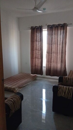 Living Room in 2 BHK Apartment at Welworth Purnam, Hinjewadi – for Rent