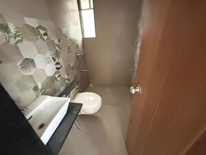 Bathroom in 4 BHK Apartment at Welworth Purnam, Hinjewadi – for Rent