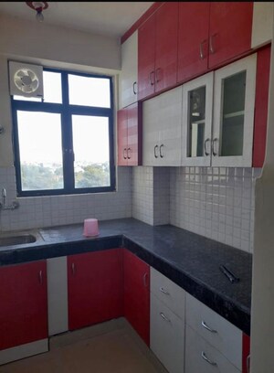 Kitchen in 2 BHK Apartment at Devika Skypers, Raj Nagar Extension – for Rent
