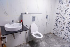 Bathroom in 4 BHK Apartment at Esteem Kings Court, Jp Nagar – for Sale