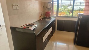 Kitchen in 2 BHK Apartment at Kumar Pebble Park, Hadapsar – for Rent