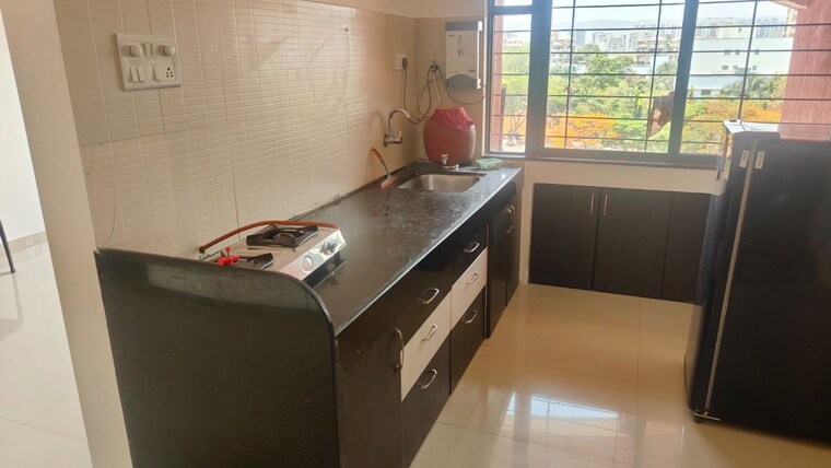 Kitchen, kumar-pebble-park 2 Bedroom 950 Sq.Ft. Apartment In Hadapsar Pune 10375723