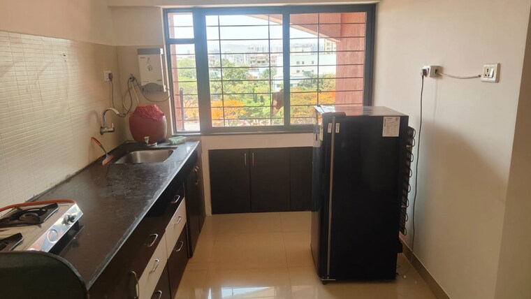 Kitchen, kumar-pebble-park 2 Bedroom 950 Sq.Ft. Apartment In Hadapsar Pune 10375723