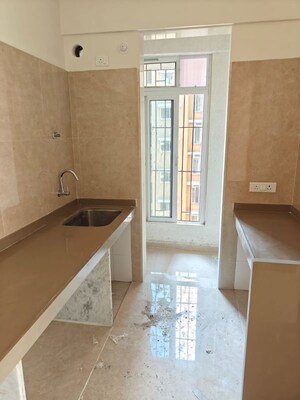 Kitchen in 2 BHK Apartment at Dosti West County, Balkum Pada – for Rent