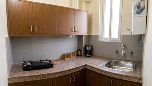 Kitchen in 1 BHK Apartment at AVJ Heightss, Zeta I Greater Noida – for Rent