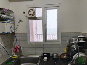 Kitchen in 2 BHK Apartment at Gaur Atulyam Gravity, Omicron I Greater Noida – for Rent
