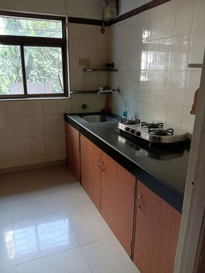Kitchen in 2 BHK Apartment at Acme Enclave, Malad West – for Rent